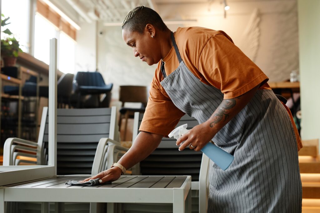 Cleaning Furniture In Cafe